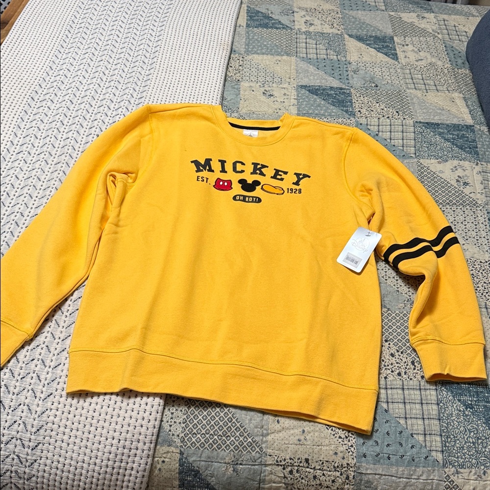 Disney yellow Sweatshirt. NWT